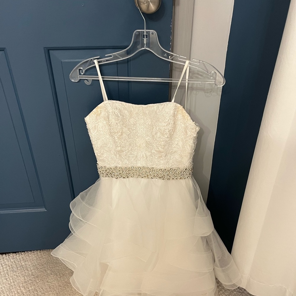 Worn once. Absolutely gorgeous dress! Pearl and bead styling and flowery design